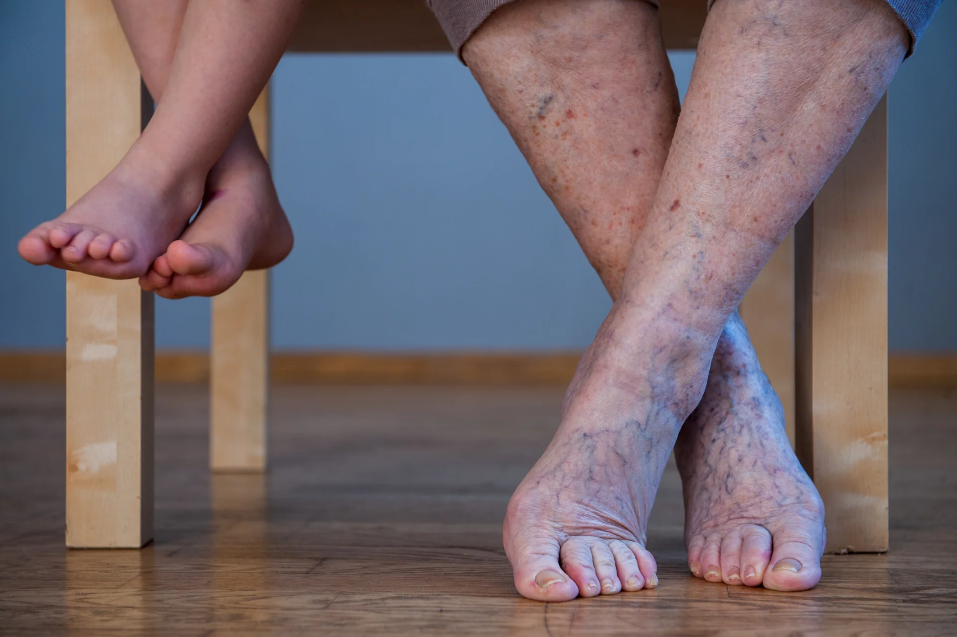 child and senior feet next to each other 2026 03 26 05 36 22 utc
