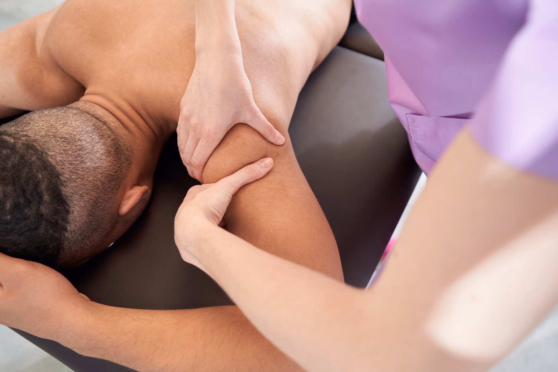 male patient receiving therapeutic massage in well 2026 03 10 02 05 42 utc converted