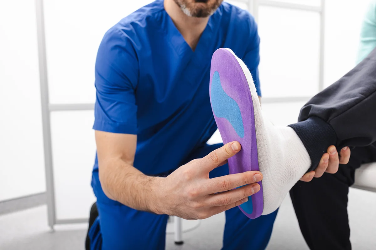 adult male applying insole